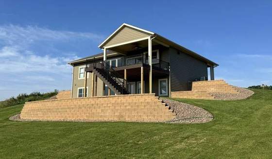 Finished walkout ranch with terraced block walls and new lawn